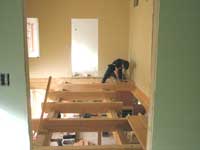Spencer West installing joists on the walkway beams